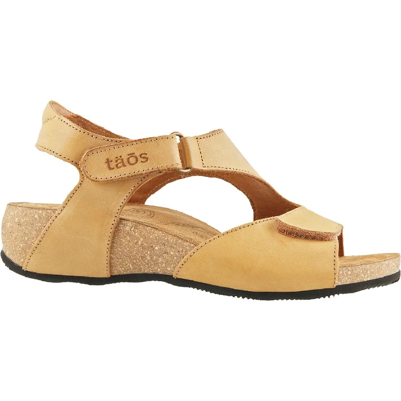 Men's sandals with a decorative buckle or charmWomen's Taos Rita Tan Leather